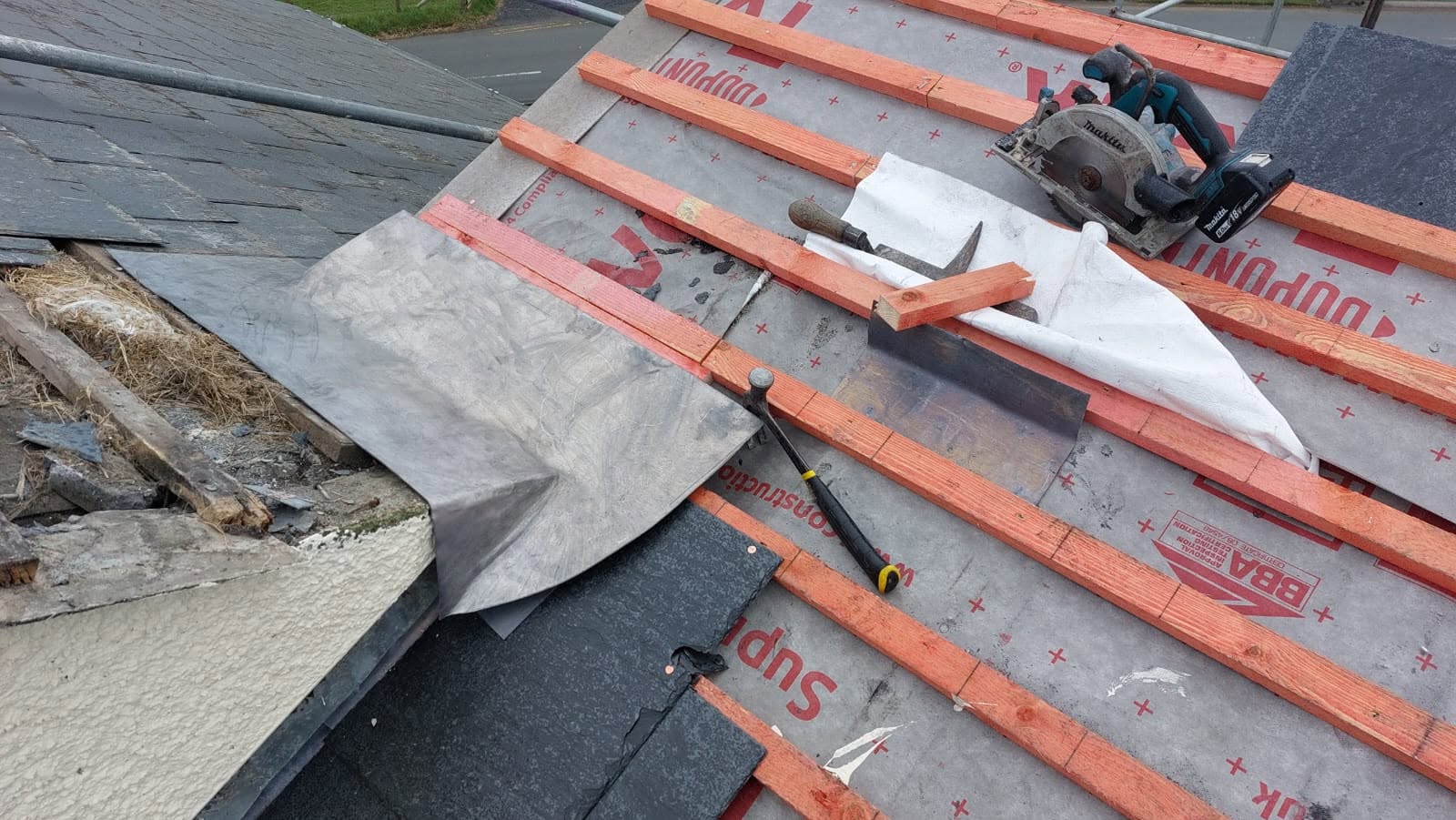 Welsh slate being laid on a heritage roof